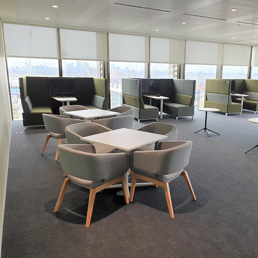 Roomes reception chair with a wooden beech frame in an office setting